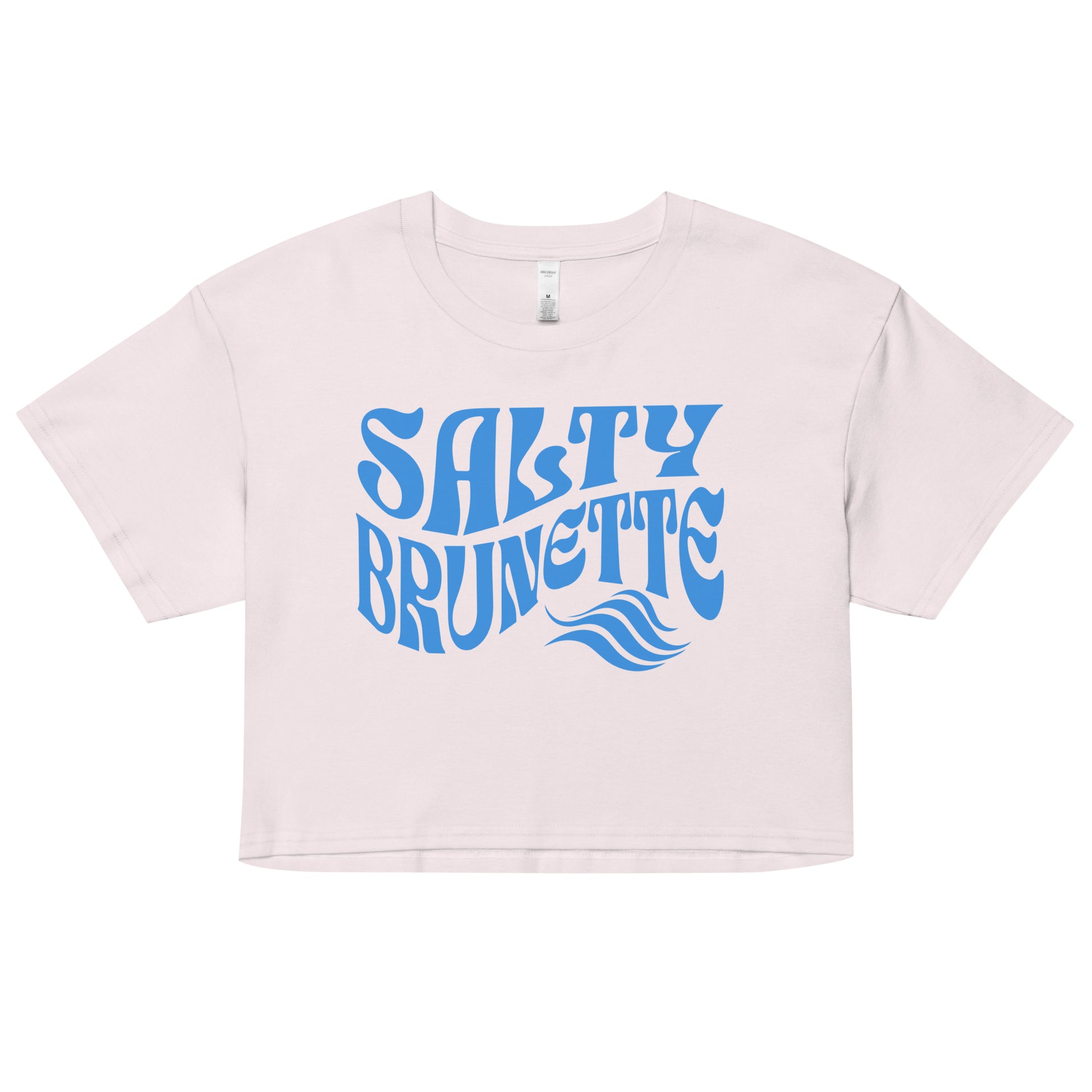 Flatlay of a orchid loose women's crop top t-shirt with the words ‘Salty Brunette' in blue retro 70s font