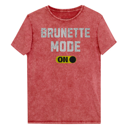 red denim-style unisex t-shirt with bold distressed white Univercity font reading “Brunette Mode” and a yellow on/off switch graphic in the “On” position beneath. The design includes subtle worn texture for a vintage look. Branded RedBlonde London in red on inside neck and right sleeve