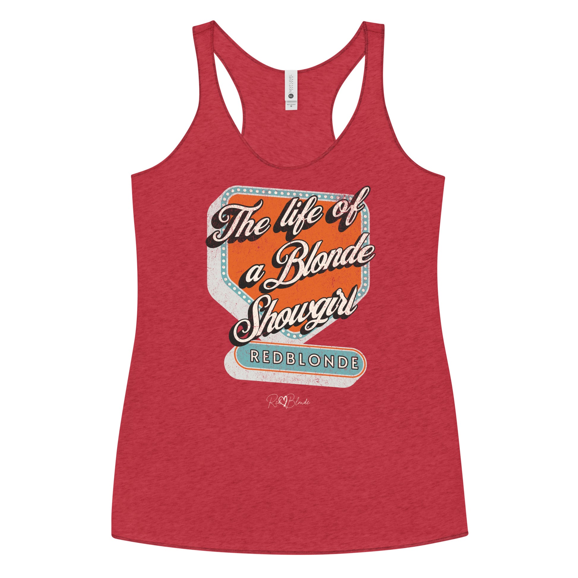 Vintage red racerback tank t-shirt with bold retro-style graphic text reading 'The life of a Blonde Showgirl' in white script over an orange and turquoise marquee design. The word 'RedBlonde' is displayed in turquoise block letters at the bottom, with subtle worn details giving the shirt a distressed, retro look." 