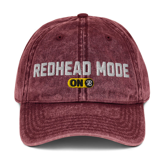 red denim cap with 'Redhead Mode ON' embroidered in white Univercity font with RB logo
