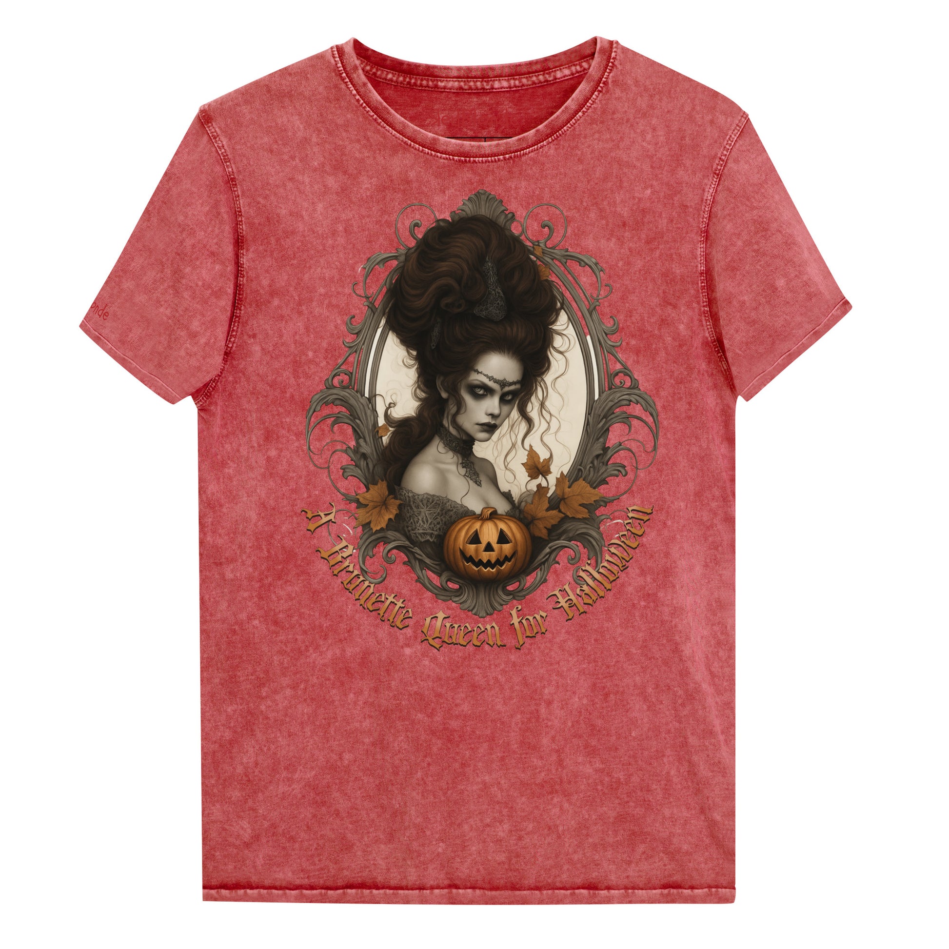 red garnet acid-wash unisex T-shirt featuring a gothic-style illustration of a dark-haired woman with an elaborate beehive hairstyle, framed by ornate scrollwork, autumn leaves, and a carved pumpkin. The design is captioned with the text ‘A Brunette Queen for Halloween’ in vintage Dark Angle lettering. Branded RedBlonde in red on inside neck and right sleeve