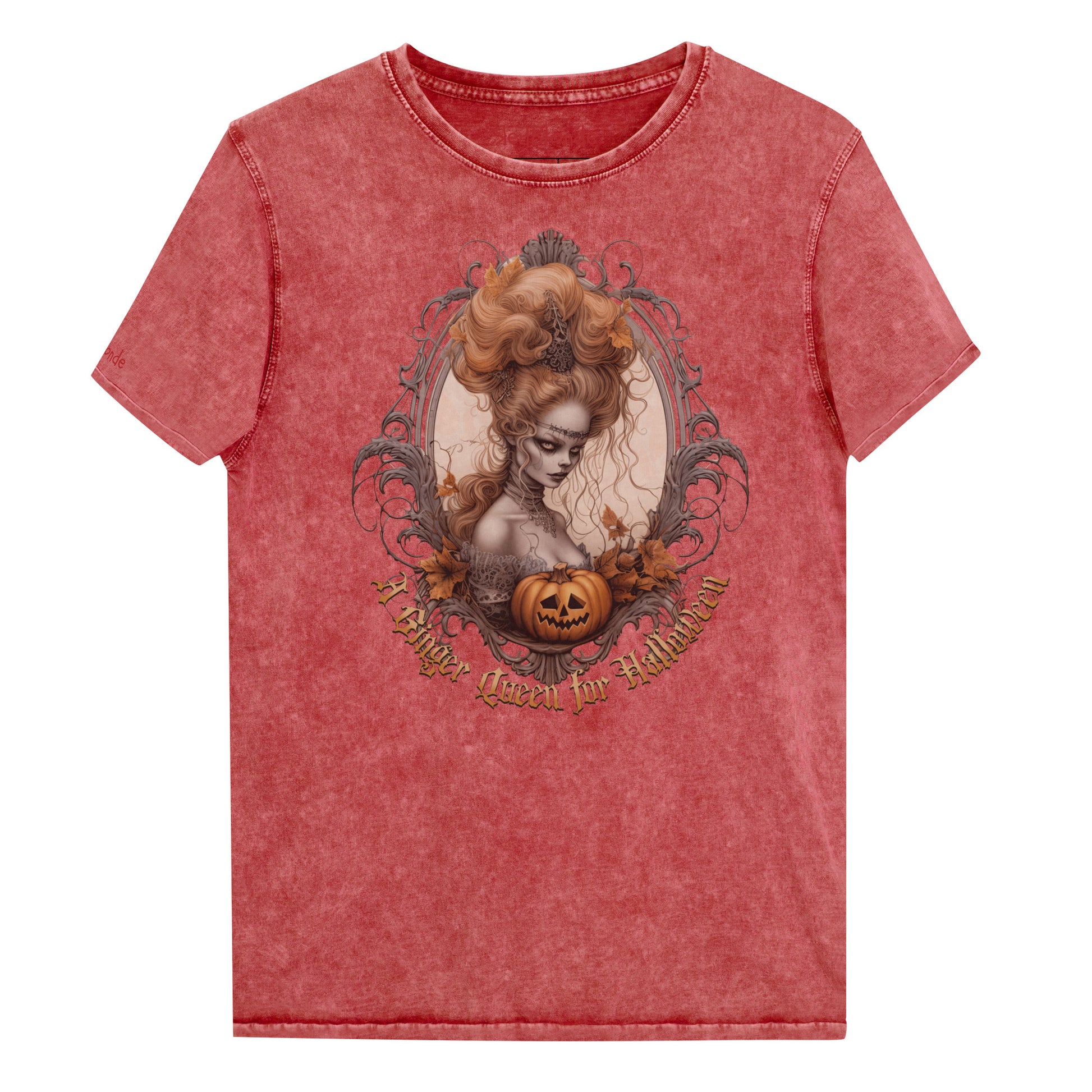 Red garnet acid-wash unisex T-shirt featuring a gothic-style illustration of ginger-haired woman with an elaborate beehive hairstyle, framed by ornate scrollwork, autumn leaves, and a carved pumpkin. The design is captioned with the text ‘A Blonde Queen for Halloween’ in vintage Dark Angle lettering. Branded RedBlonde in red on inside neck and right sleeve