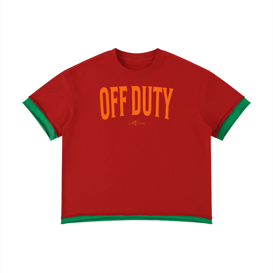 Red oversized T-shirt with a red ribbed crew neckline, green layered sleeve and hem details, and bold orange Off Duty slogan in collegiate style font across the front.