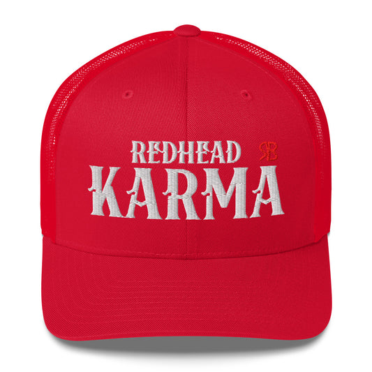 red retro trucker cap with mesh back. The front features bold white embroidered text reading "REDHEAD KARMA" with a small red RB logo to the right.