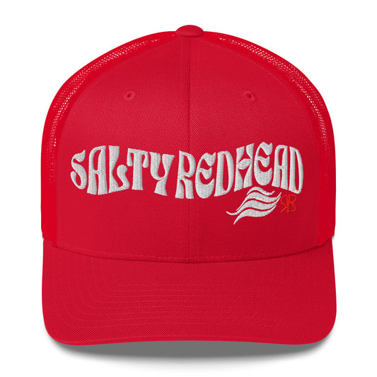 red trucker cap with 'Salty Redhead' in white Solino display font. Branded RB in red