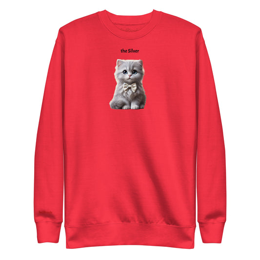 Flatlay of red relaxed fit unisex sweatshirt with a cute graphic of a silver kitten wearing a bow-tie and the words 'the Silver' linking to silver hair. Branded RedBlonde in red on inside neck and right cuff