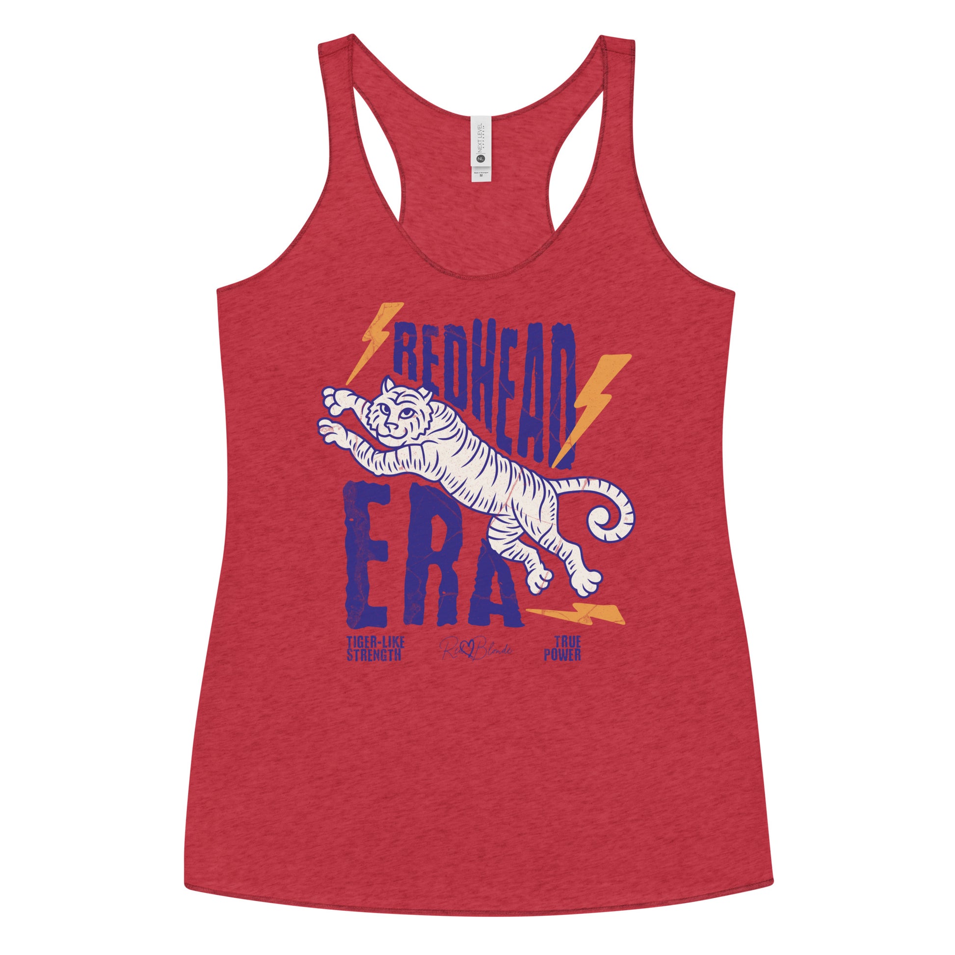 red vintage-style racerback tank features a large, stylized illustration of a tiger leaping forward in pale purple and white. Bold, distressed text above and below reads “REDHEAD ERA” in uppercase purple letters, with two orange lightning bolts flanking the text. Beneath the lion in small purple letters are the phrases “Tiger-like strength” and “True power.” RedBlonde with a heart small signature-like logo appears below the text.