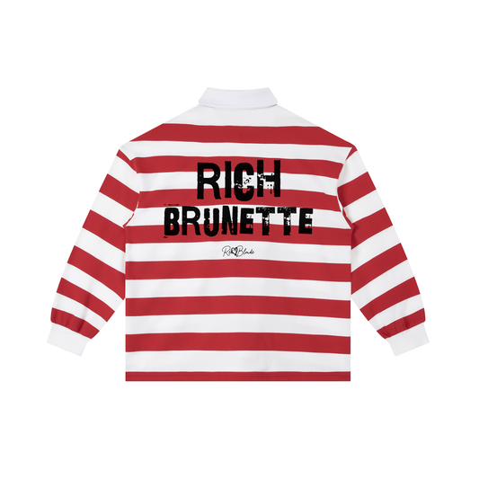 An image showing the back of a long-sleeved rugby polo shirt featuring a pattern of alternating horizontal red and white stripes. The center of the back displays the words "RICH BRUNETTE" in large, distressed Ed Gein black block lettering, with a smaller signature-style logo printed directly underneath. The shirt is finished with a solid white collar and matching white ribbed cuffs.