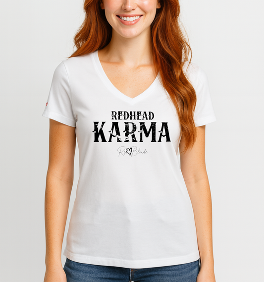 redhead wears a white v-neck women's relaxed fit t-shirt with 'REDHEAD KARMA' in Aquero white font, signed RedBlonde. Branded RedBlonde in red on inside neck and right sleeve 
