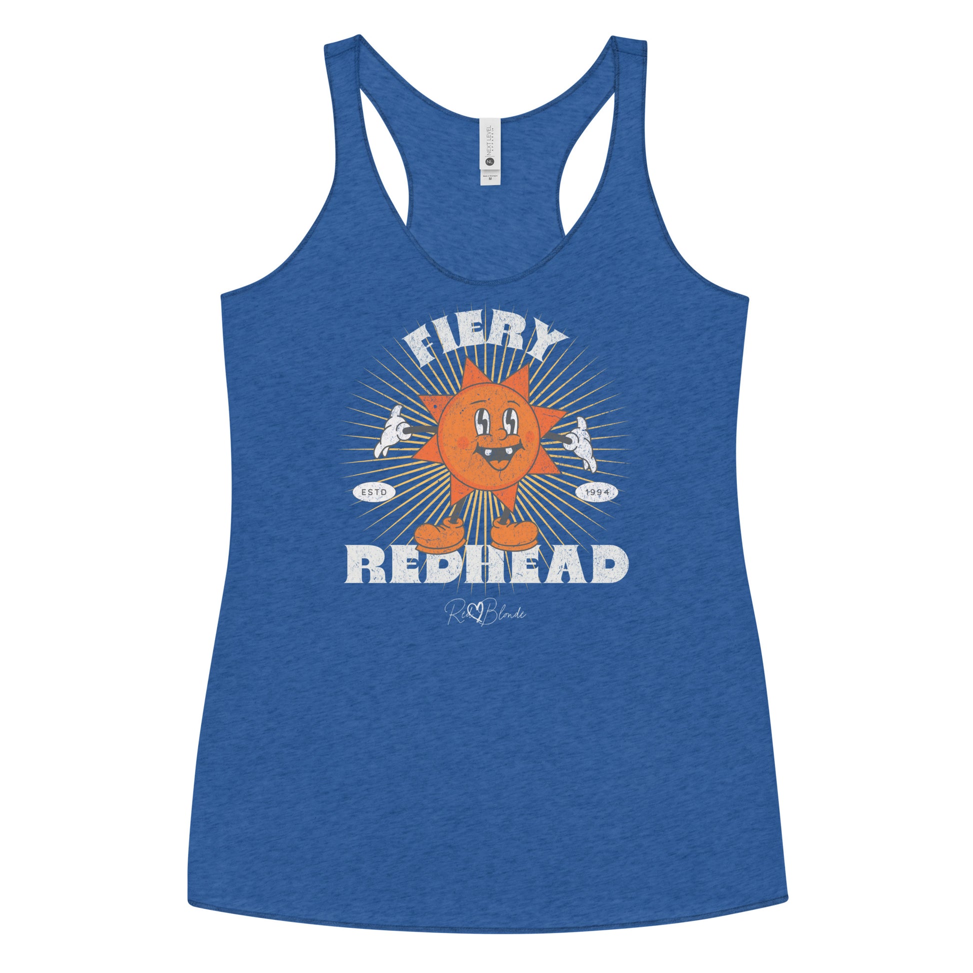 Royal Blue women’s racerback tank with a bold retro graphic of a smiling orange cartoon sun character, surrounded by radiant sunbeams. The text reads ‘Fiery Redhead’ in distressed white Belzebuth lettering with small details including ‘ESTD 1994’ and the RedBlonde signature logo beneath."