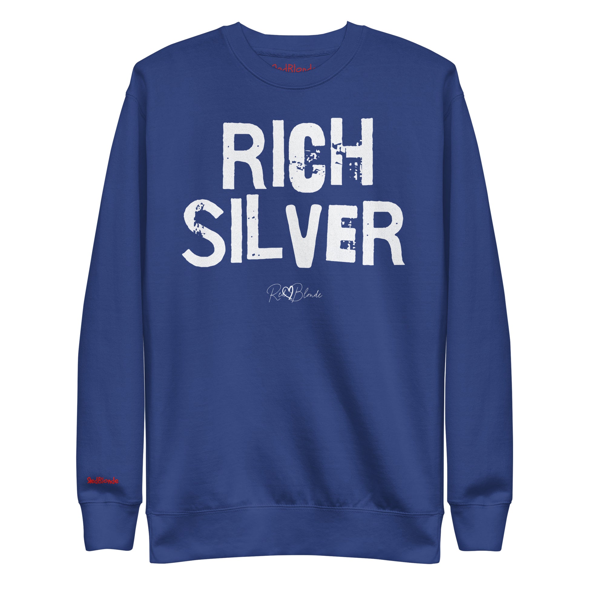 Royal Blue unisex premium sweatshirt with bold distressed white Ed Geinitext “RICH SILVER” on the front, featuring a subtle RedBlonde logo beneath the lettering and on the sleeve cuff and inside neck