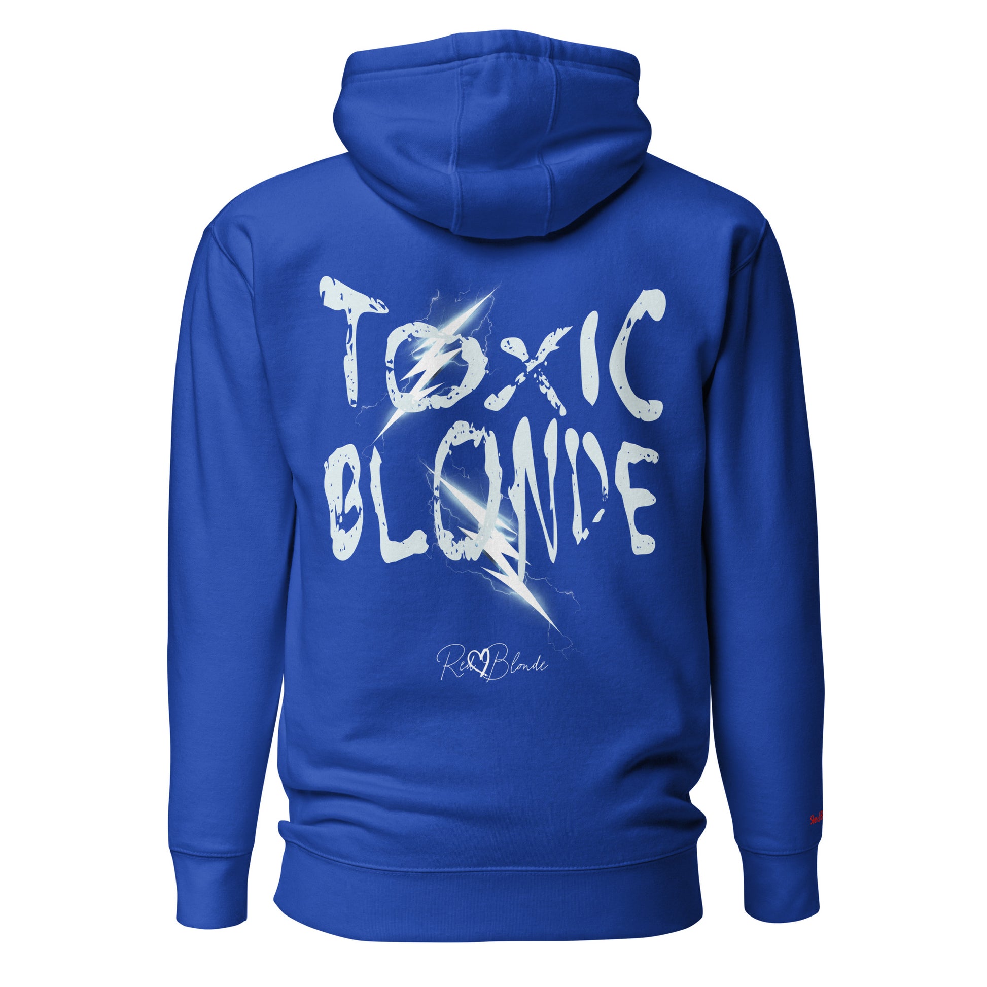 Back view of a royal blue unisex hoodie featuring bold distressed white Chainsaw Carnage text reading “Toxic Blonde” with lightning-style accents and the RedBlonde signature logo underneath. The design has an edgy, electric aesthetic.It features the text 'Blonde' embroidered on the front. Branded RedBlonde in red on right sleeve.