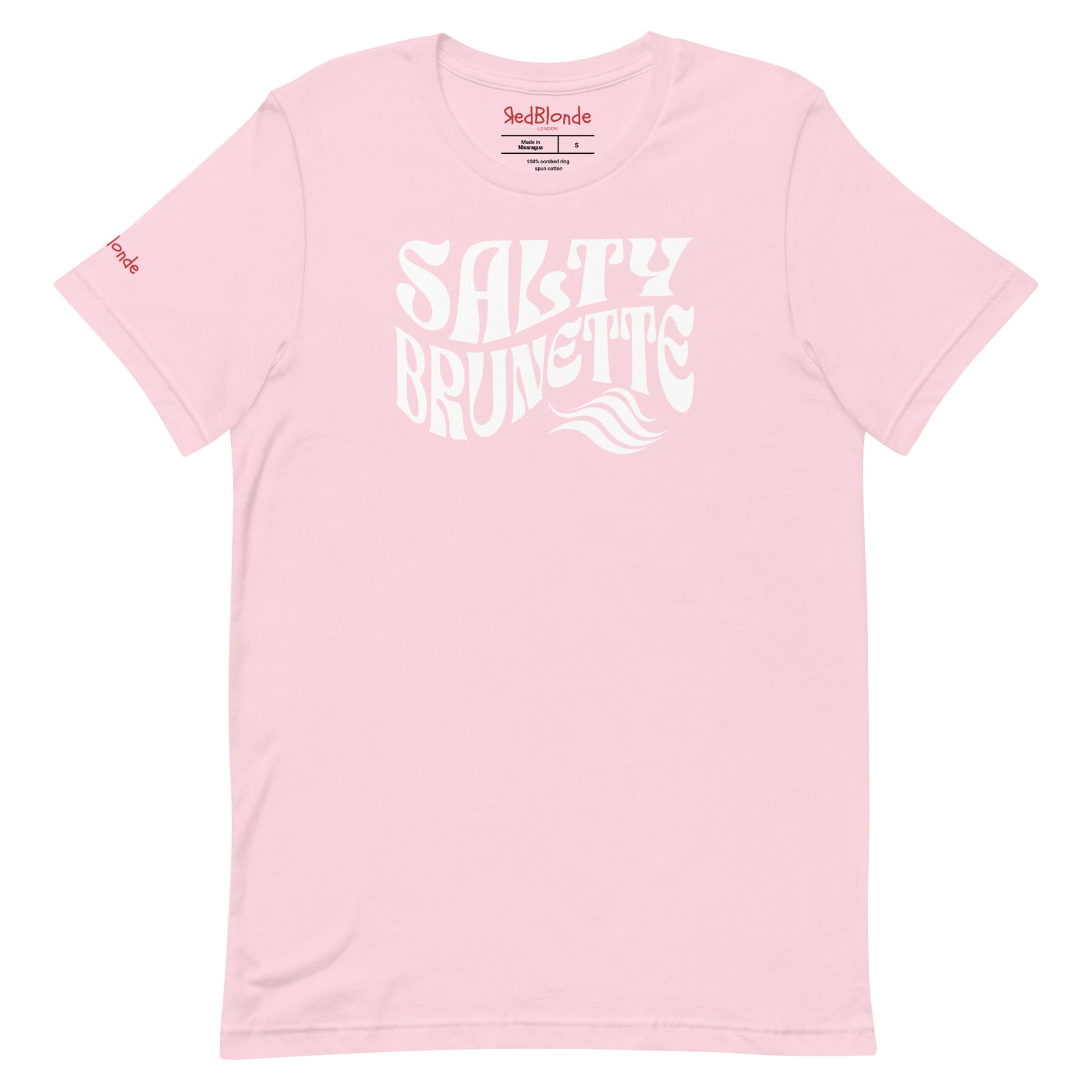flatlay of soft pink classic unisex graphic t-shirt with the slogan 'Salty Brunette' in Solino Display white retro 70s wavy font. Branded RedBlonde in red on inside neck and right sleeve