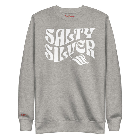 flatlay of Classic relaxed fit unisex sweatshirt in grey with 'Salty Silver' play on words slogan in white retro 70s wavy text. Branded RedBlonde on inside neck and right cuff in red