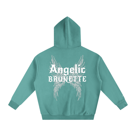teal oversized fleeced hoodie with a back print featuring white gothic “Angelic Brunette” text layered over large angel wing artwork.
