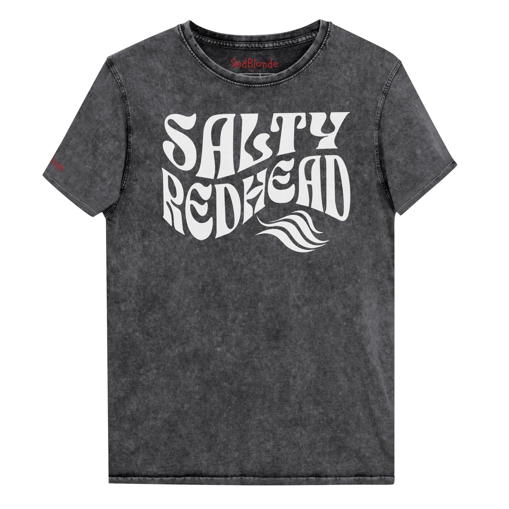 flatlay of a unisex black relaxed fit denim-wash t-shirt with the words 'Salty redhead' in retro 70s vibe text in white. Branded Redblonde on inside neck and right shoulder in red