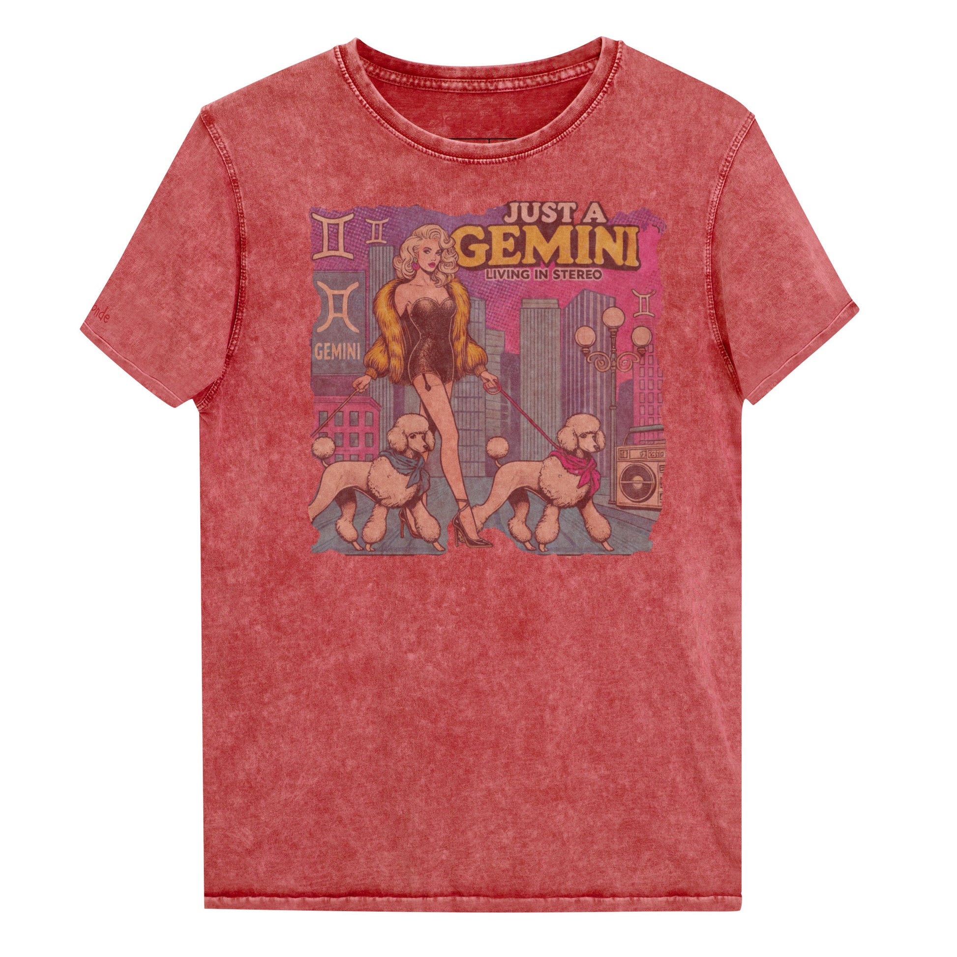 Flatlay of a unisex garnet red denim wash vintage t-shirt with a retro pop-art Gemini graphic featuring a blonde woman, in a short catsuit and fur coat walking two poodle dogs with neck scarfs with a city backdrop and a gettoblaster ‘Just a Gemini, Living in Stereo'. Branded RedBlonde on inside neck and right shoulder