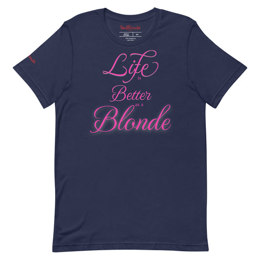 Flatlay of a unisex navy relaxed fit graphic t-shirt with the slogan 'life is better as a blonde' in pink 'monte carlo' font, like slanted handwriting. Branded RedBlonde London in red on inside neck and right sleeve 