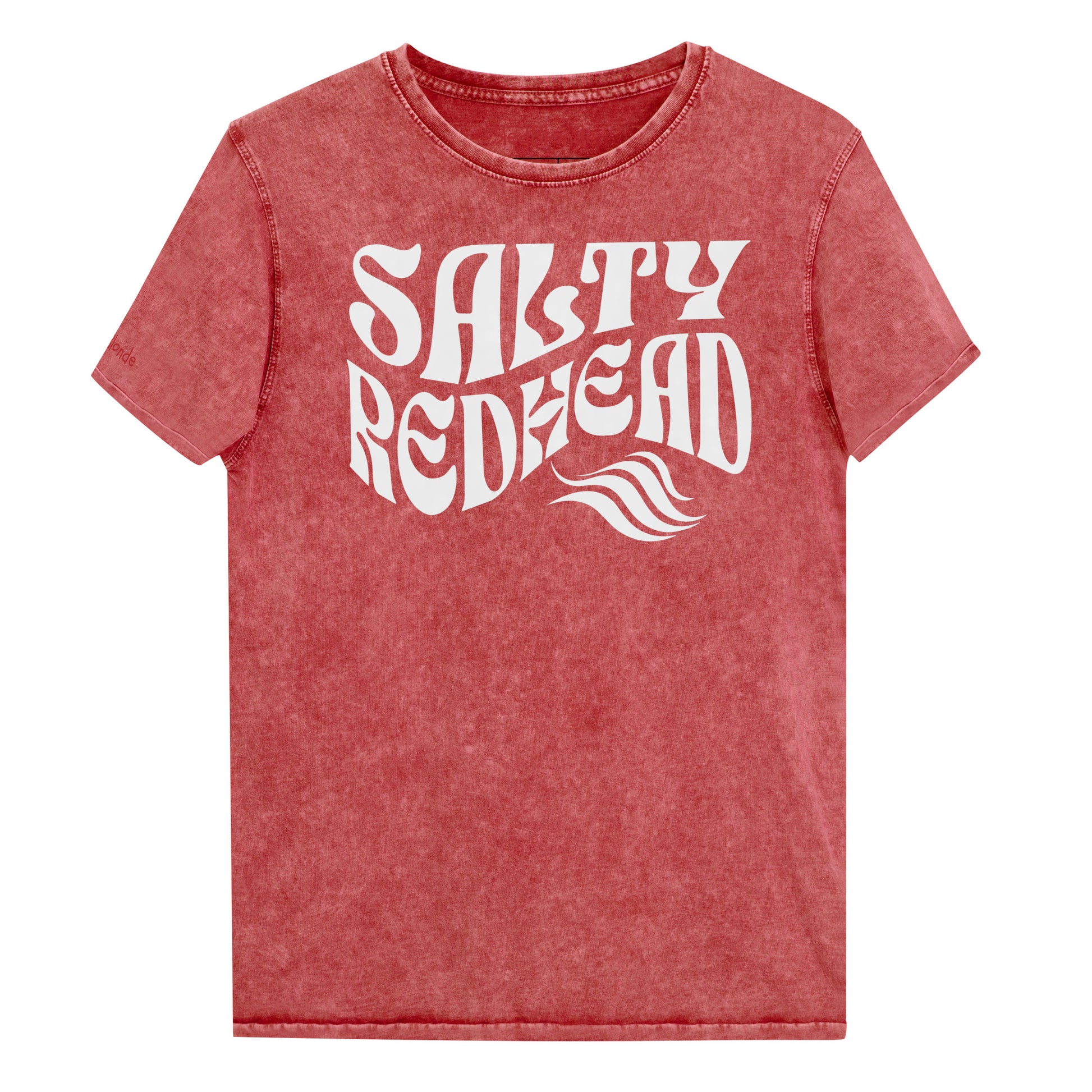 flatlay of a unisex red relaxed fit denim-wash t-shirt with the words 'Salty redhead' in retro 70s vibe text in white. Branded Redblonde on inside neck and right shoulder in red