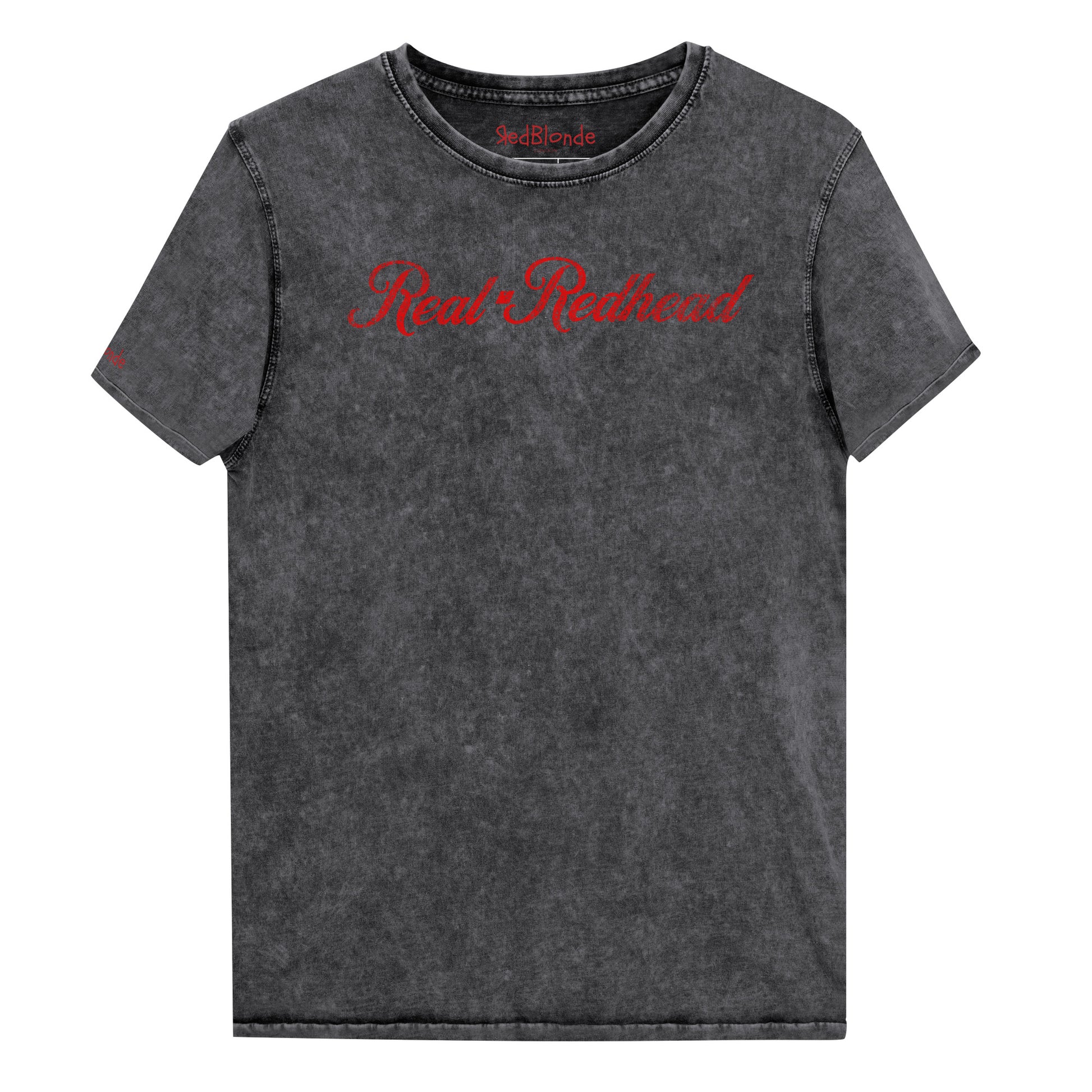 Flatlay of unisex relaxed fit black vintage denim wash slogan t-shirt with 'Real Redhead' in milkshake script red font. Branded RedBlonde in red on inside neck and right sleeve