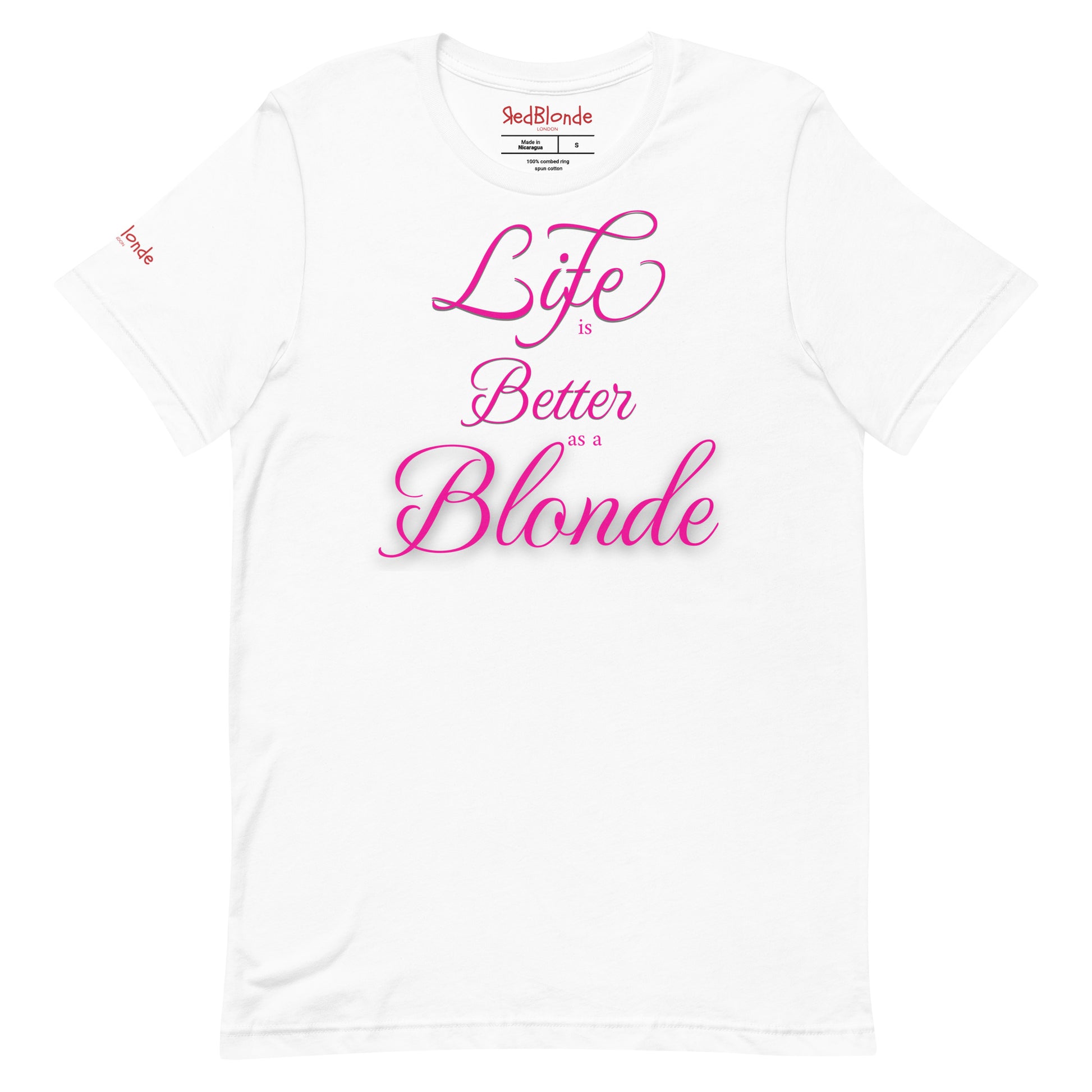 Flatlay of a unisex white relaxed fit graphic t-shirt with the slogan 'life is better as a blonde' in pink 'monte carlo' font, like slanted handwriting. Branded RedBlonde London in red on inside neck and right sleeve 