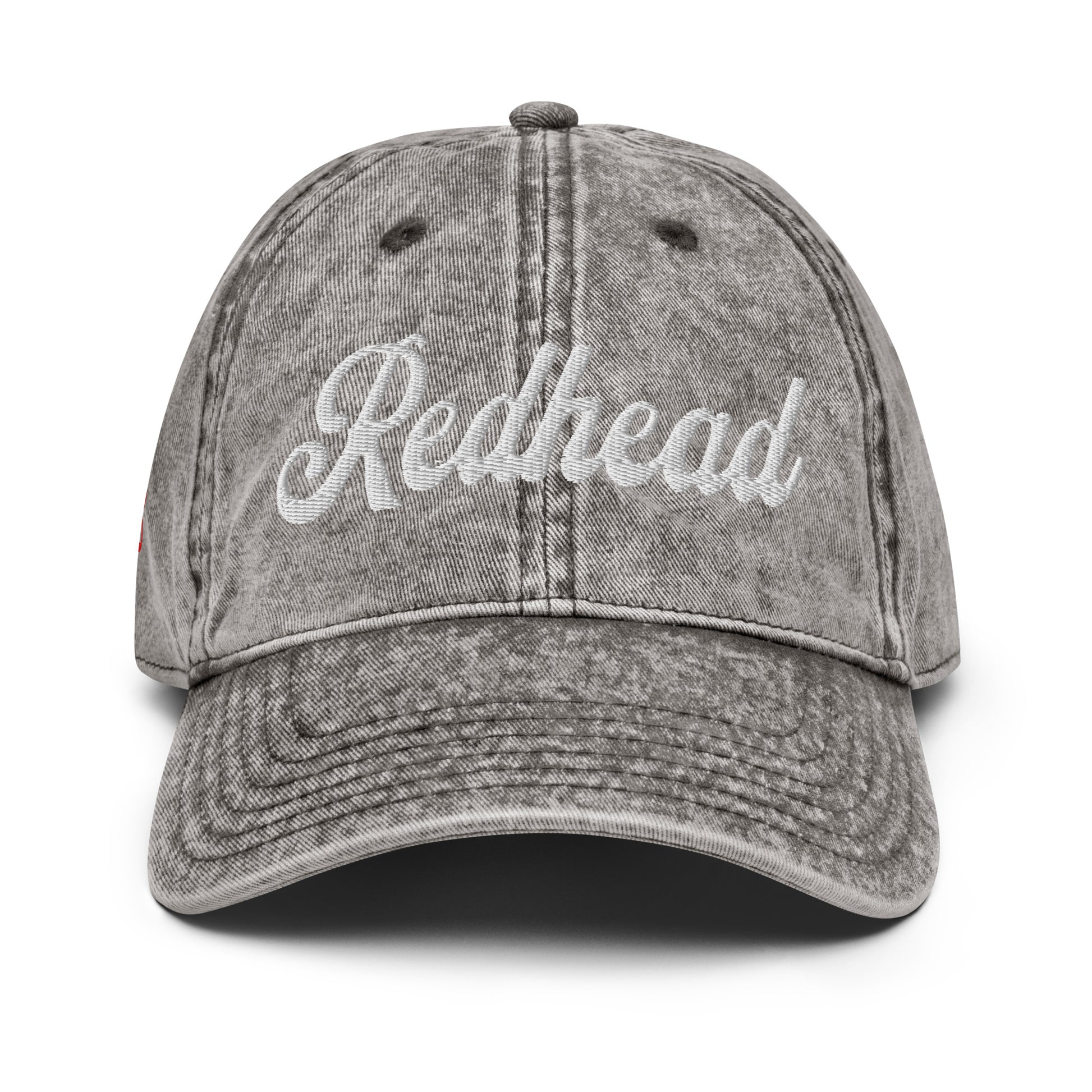 vintage gray denim wash effect baseball cap with the word 'Redhead' embroidered on the front in white adventure type script font 