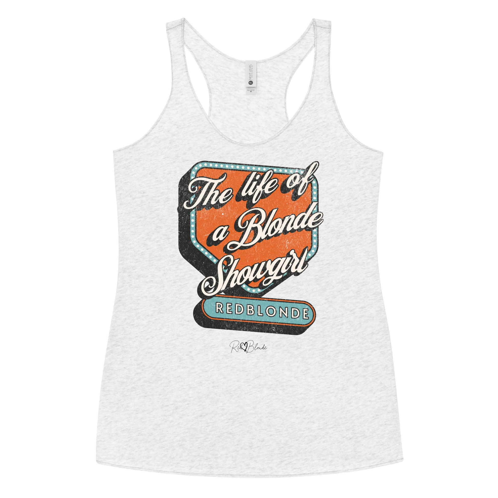 heather white racerback tank t-shirt with bold retro-style graphic text reading 'The life of a Blonde Showgirl' in white script over an orange and turquoise marquee design. The word 'RedBlonde' is displayed in turquoise block letters at the bottom, with subtle worn details giving the shirt a distressed, retro look." 
