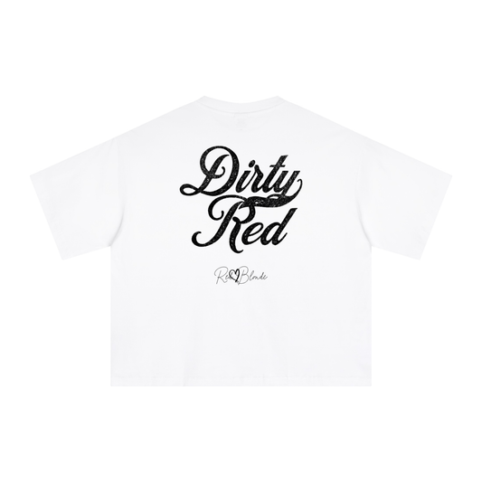The back of a white oversized boxy short-sleeve T-shirt laid flat on a white background. Large distressed black Milkstore 01 script text reads “Dirty Red,” with a small cursive “RedBlonde” logo beneath the main graphic.