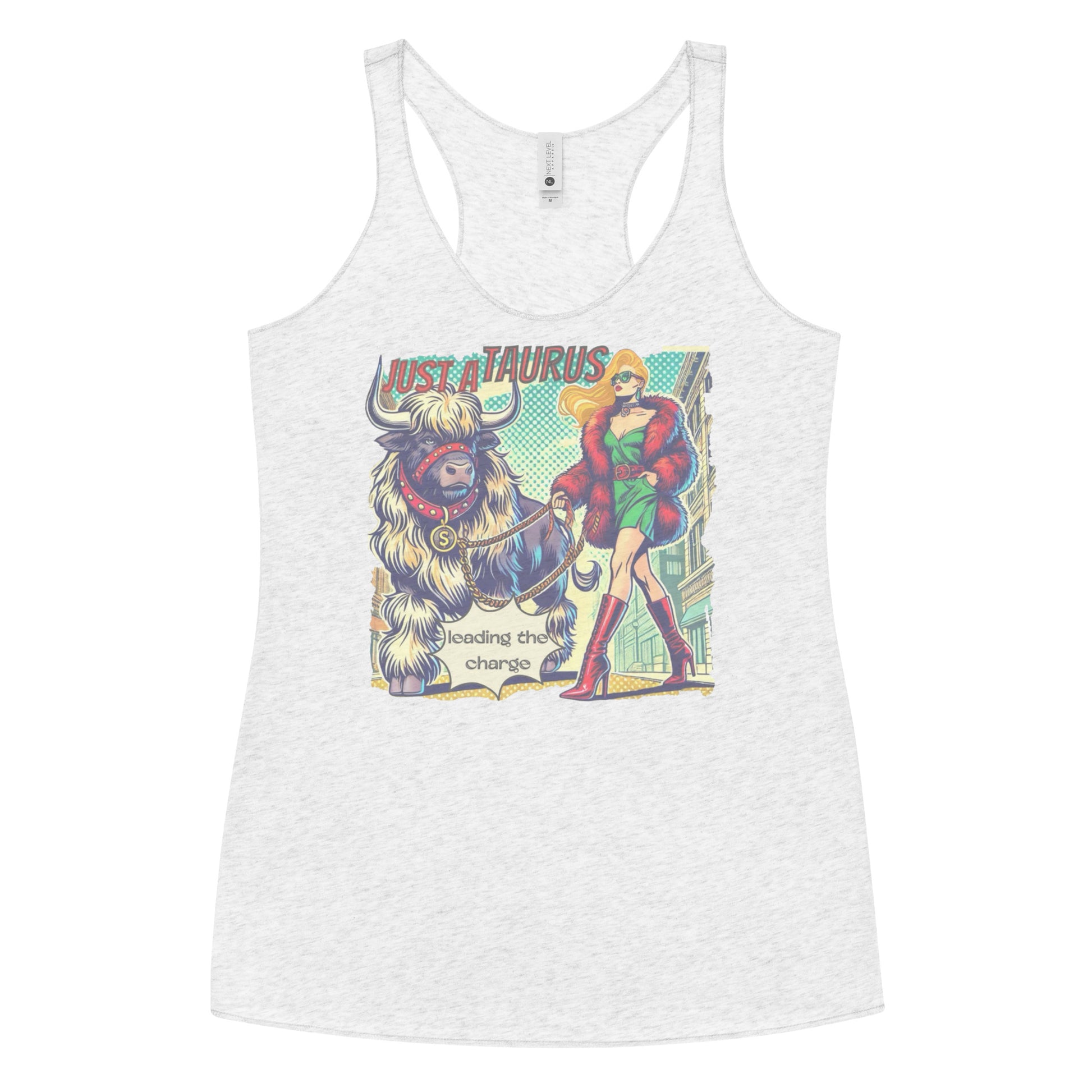 Flatlay of a heather white soft racerback tank t-shirt with a retro pop-art blonde taurus graphic featuring a blonde woman with long flowing straight hair, wearing a green dress with a red belt, red high-heeled boots and red fur coat, walking a furry bull with a red collar and medallion in city street captioned ‘Just a taurus leading the charge'