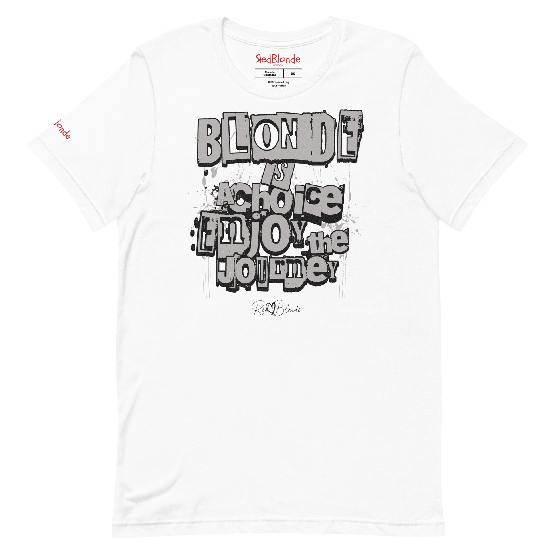 A white unisex T-shirt with a classic crew neckline and short sleeves. The front displays a bold, graffiti-style text design in black, white, and gray. The words read: “BLONDE is a choice, ENJOY the JOURNEY” with varied fonts and a layered street-art effect. The RedBlonde brand name is subtly printed below in a handwritten script. Branded RedBlonde london in red on inside neck and right sleeve