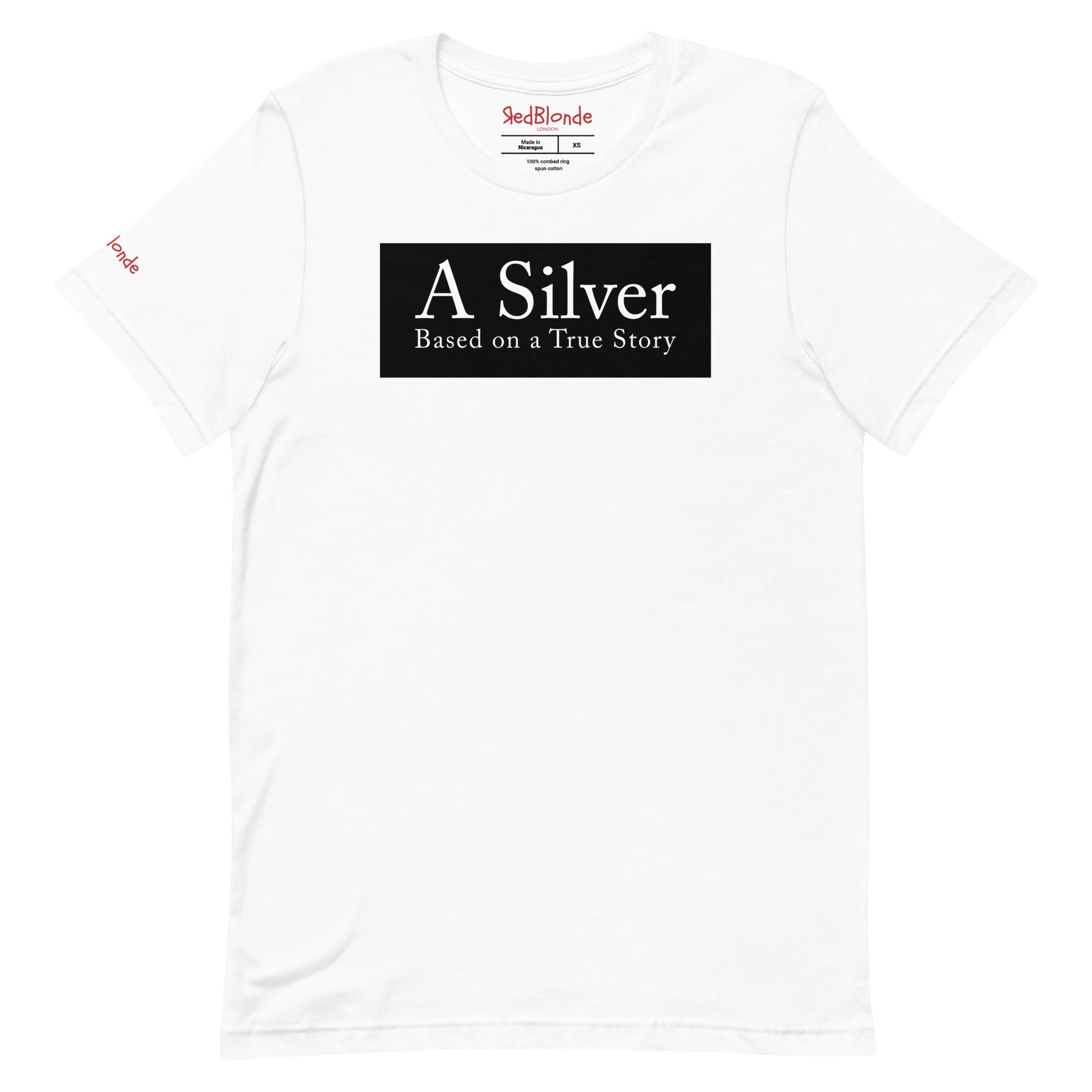 flatlay of a white unisex relaxed fit t-shirt with the slogan 'A Silver - Based on a True Story' in white text in a black box graphic. Branded RedBlonde London in red on inside neck and right sleeve