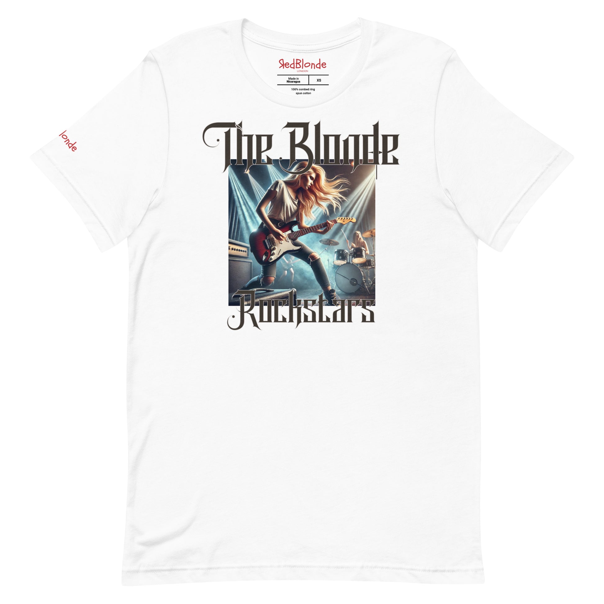 A white unisex t-shirt with a graphic of a blonde female rock guitarist on stage with a drummer in the background, illuminated by stage lights. The text ‘The Blonde Rockstars’ is in bold, metallic avalen rekas font above and below the image. Branded RedBlonde London in red on the inside neck and right sleeve.