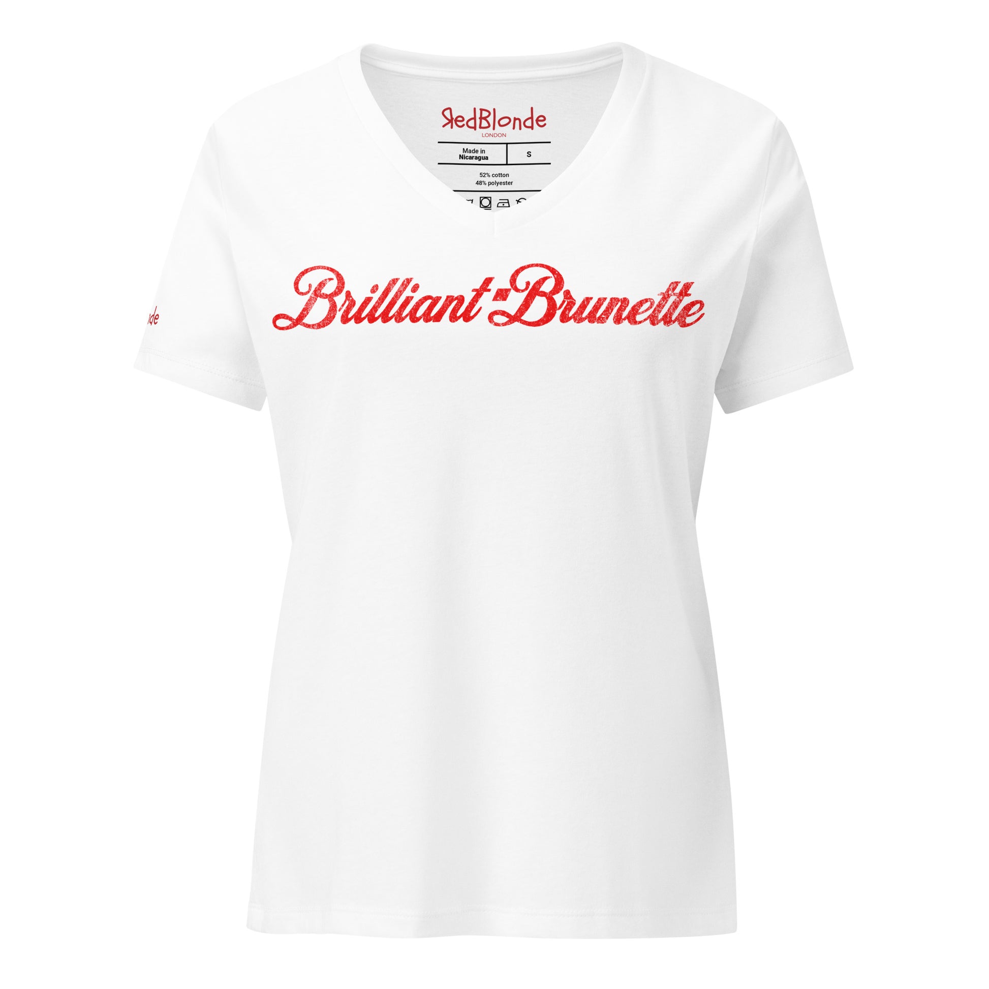 Flatlay of white women's relaxed fit v-neck slogan t-shirt with 'Brilliant Brunette' in milkshake script red font. Branded RedBlonde in red on inside neck and right sleeve