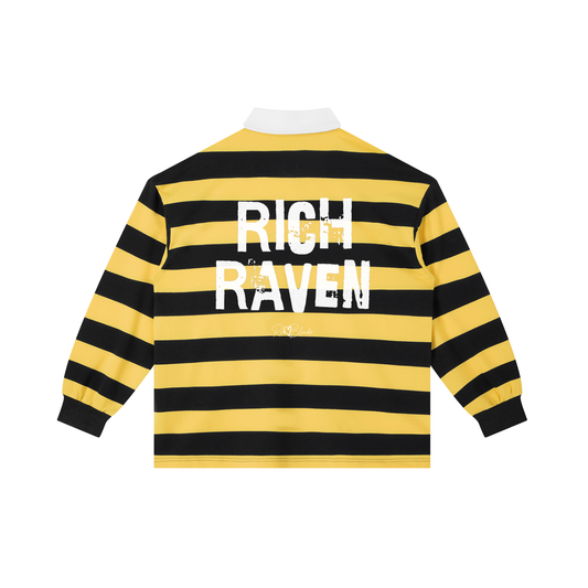 An image showing the back of a long-sleeved rugby polo shirt featuring a pattern of alternating horizontal yellow and navy stripes. The center of the back displays the words "RICH RAVEN" in large, distressed Ed Gein white block lettering, with a smaller signature-style logo printed directly underneath. The shirt is finished with a solid white collar and matching white ribbed cuffs.